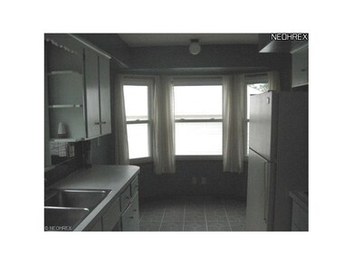 This kitchen in fully applianced with an eating ar