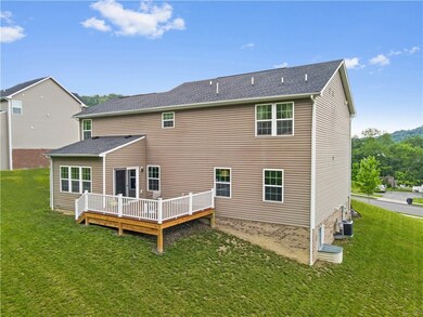 A large maintenance-free deck spills out into a gr