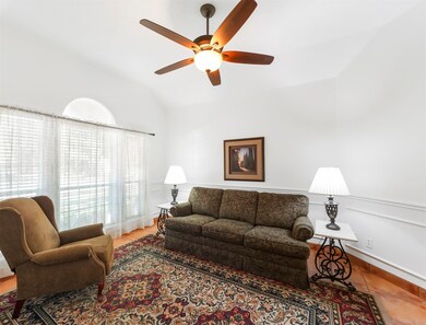 This flexible room is now being used as a formal living room. Would make a great office! Features tons of natural light, fresh white paint and a ceiling fan.