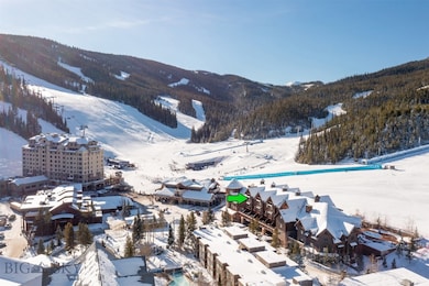 Snowy aerial view featuring a mountain view