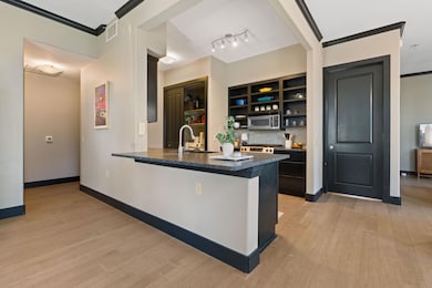 Bar with visible vents, baseboards, stainless ste