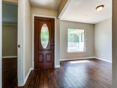 This photo shows the entry from inside the home. The space to the right is you formal dining room. This could also be a home office if you don't desire a formal dining room. The huge picture window is a nice touch to make this room light and bright. 