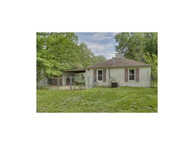Rear of Home with Double Gate into Backyard from C