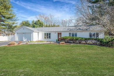 Ranch-style house featuring fence, driveway, roof 
