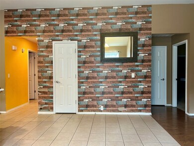 Tiled empty room with baseboards