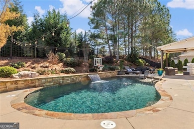 Outdoor oasis with pebbletec saltwater pool!