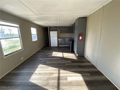 Unfurnished room with dark wood finished floors