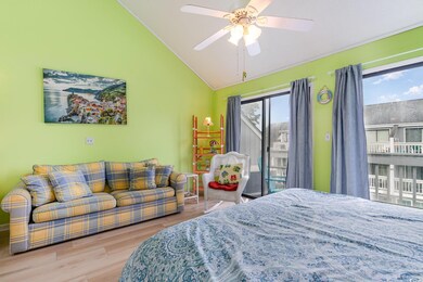 Bedroom featuring multiple windows, ceiling fan, a