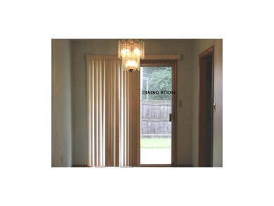 Formal dining room, slider  out to patio and fence