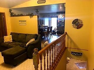 Living room entrance to kitchen and basement