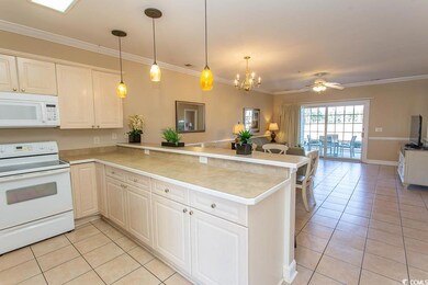 Kitchen featuring white appliances, kitchen penins