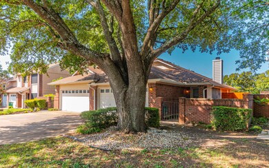 View of front of property with brick siding, driv