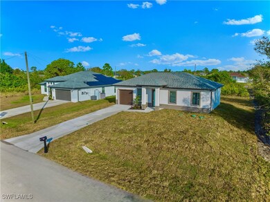 Single story home with a front yard and a garage