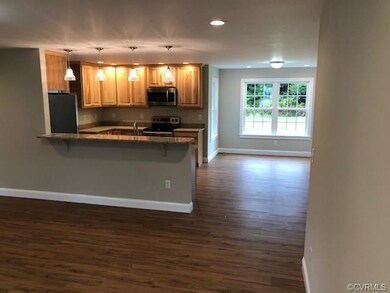 looking over breakfast bar from living room into k