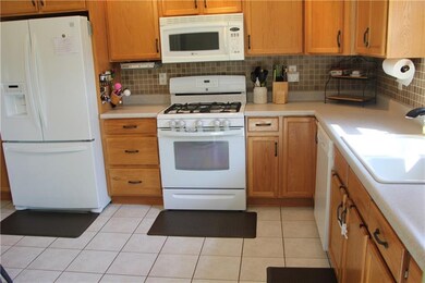Eat in kitchen with ample cabinet/ counter space.