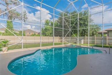 Alternate view of pool, spill over spa, large yard