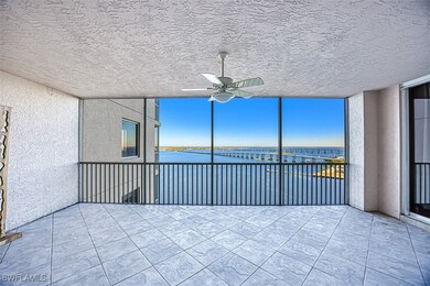 Unfurnished sunroom featuring a water view and cei