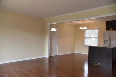 Dining is open to living and kitchen.