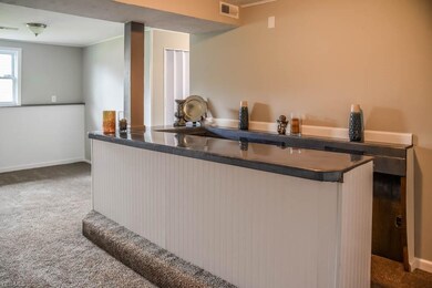 Family room on the lower level with a bar!