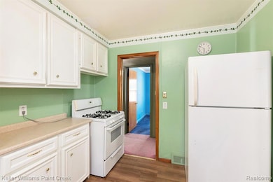 Offering newer flooring, loads of counters, and ample cabinet storage.