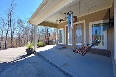 COMFORTABLE COVERED PORCH FOR WATCHING THOSE GAMES