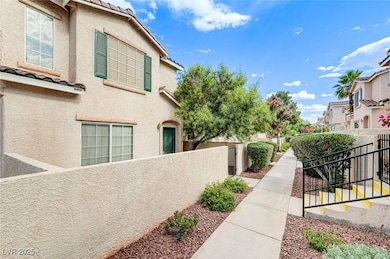 View of side of property with stucco siding, a fen