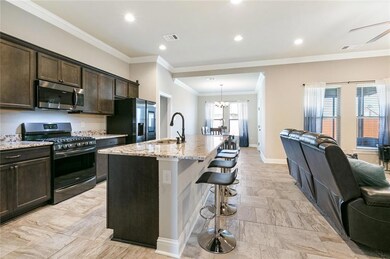 Another view of the Kitchen with the Dining area i