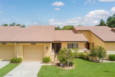 View of front of property featuring concrete drive