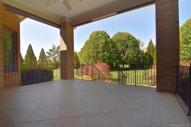 Large, covered back porch overlooking back yard