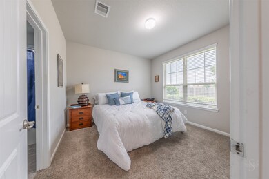 2nd bedroom located at the front of the home with a private ensuite bath.