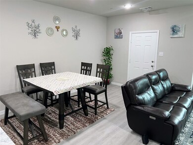 Dining room with light hardwood / wood-style flooring