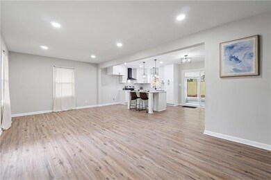 Unfurnished living room with baseboards, recessed 