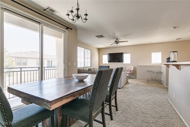 Dining room with light colored carpet, a ceiling f