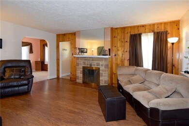 This huge living room with laminate flooring has m