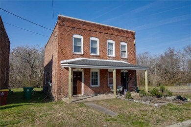 Townhome / multi-family property with brick siding