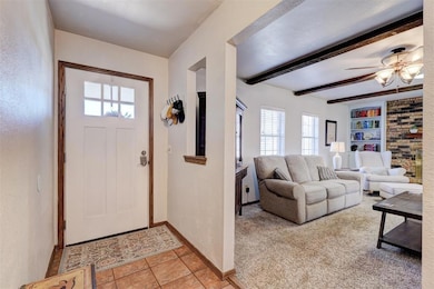 Entryway featuring light tile patterned flooring, 