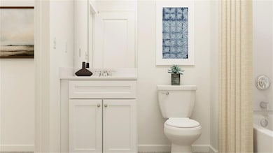 Full bathroom featuring vanity, shower / bath combination with curtain, and toilet