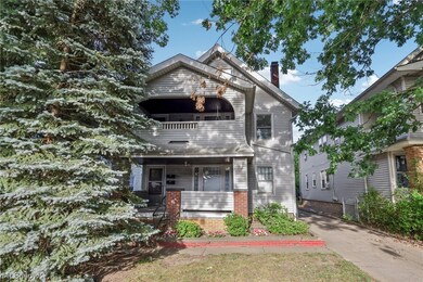 View of front of house with a balcony and a porch