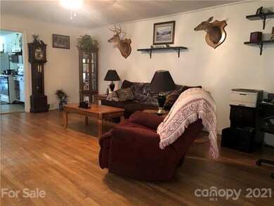 Additional view of living room with wood floors
