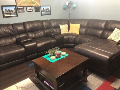 Spacious Living room with new dark laminate wood f