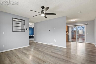 Unfurnished room featuring ceiling fan, built in f