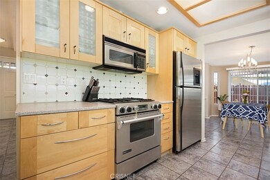 Light contemporary cabinets and Jennair oven and range