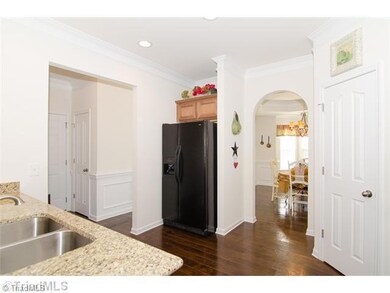 Kitchen. This Inviting Kitchen is Open to the Living Area making Entertaining a Breeze! Arched doorway leads to Dining Room