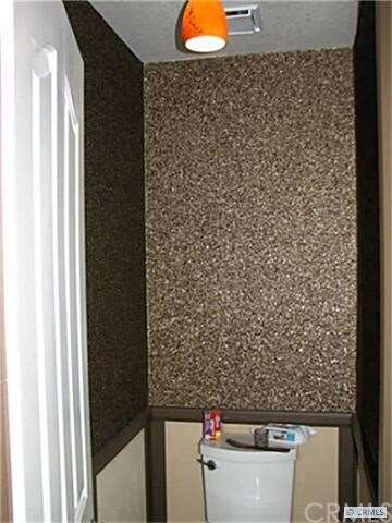 Master bathroom commode enclosure