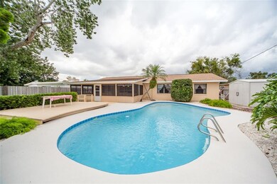 9 ft deep pool, fenced back yard, deck, storage bu