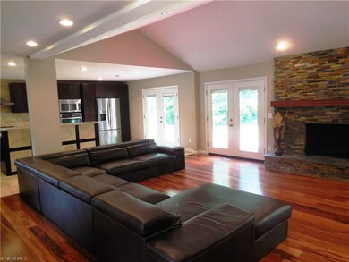 GREAT ROOM WITH BRAZILIAN WOOD FLOORING OPENS TO S