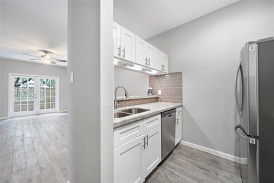 The sink, faucet, and garbage disposal are also br