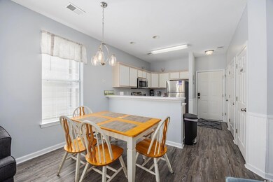 Dining space featuring a notable chandelier and da