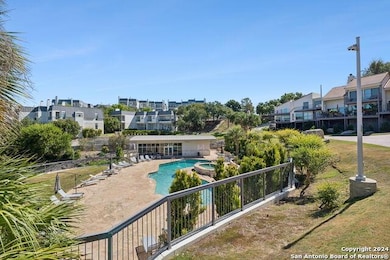 View of swimming pool featuring a patio area, a p
