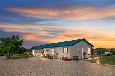 View of front of house with a metal roof